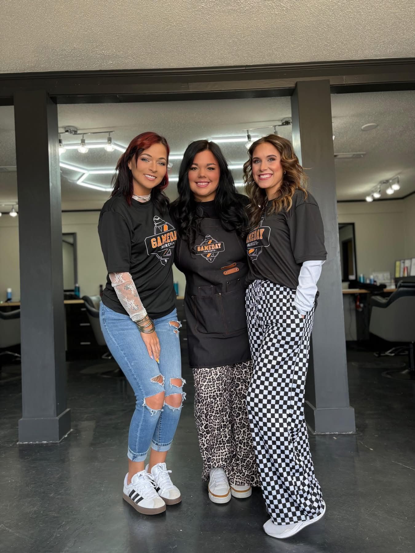 Three women wearing black 