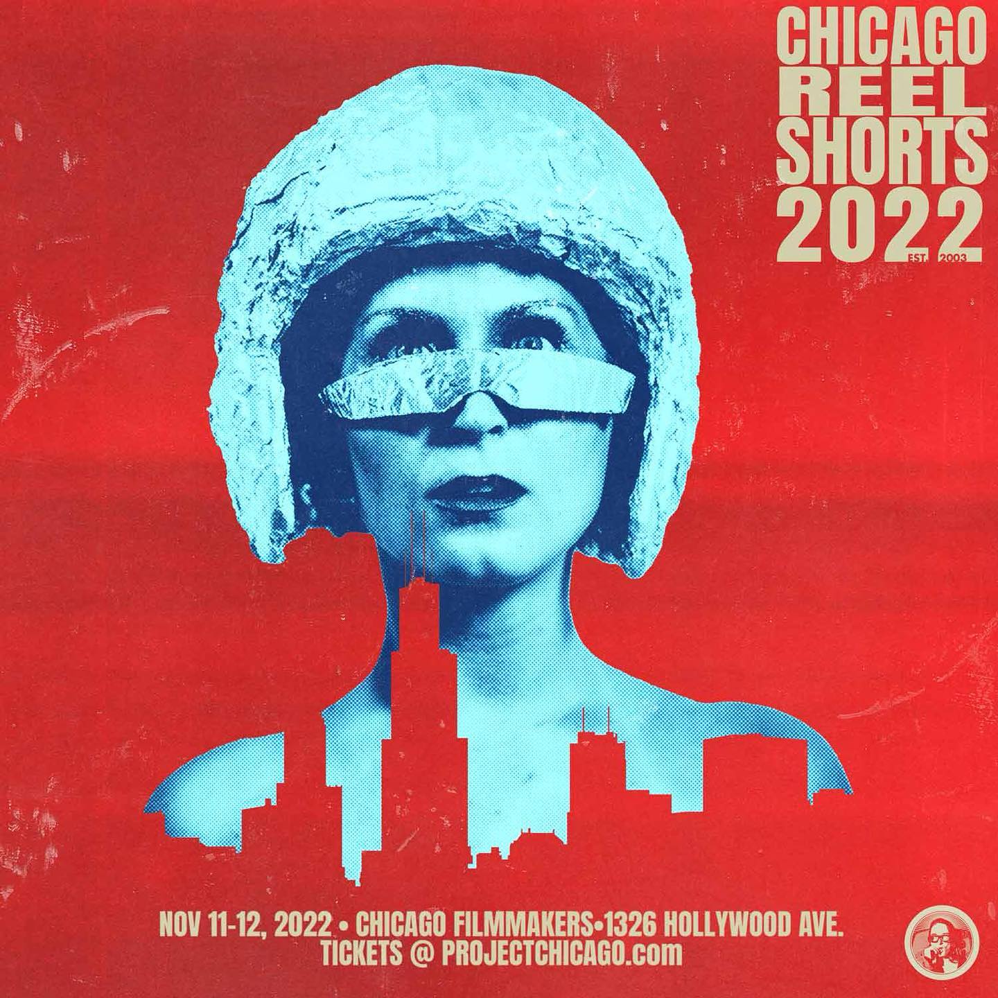 Poster for Chicago Reel Shorts 2022 with a woman in a helmet and sunglasses against a red background, with a Chicago skyline.