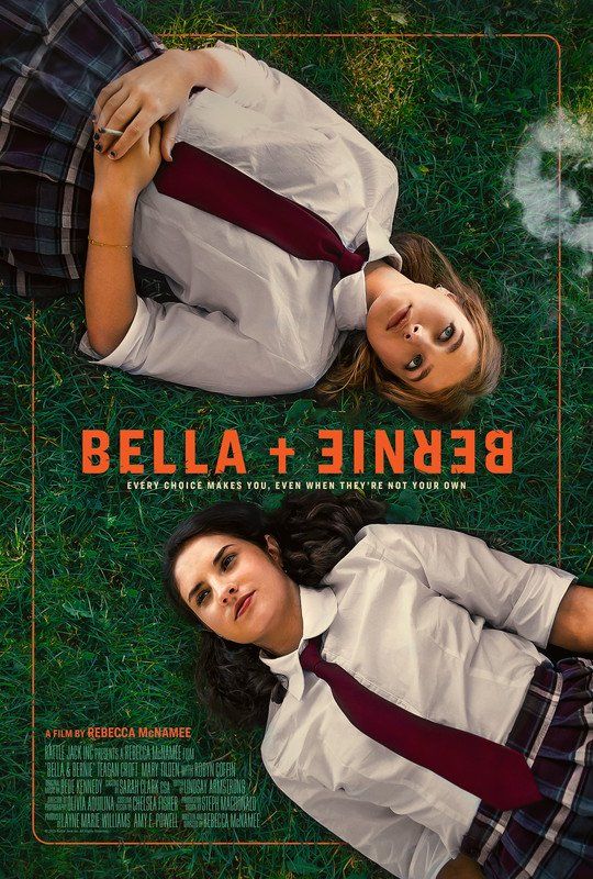 Two girls in school uniforms lie on grass, looking up; movie poster for