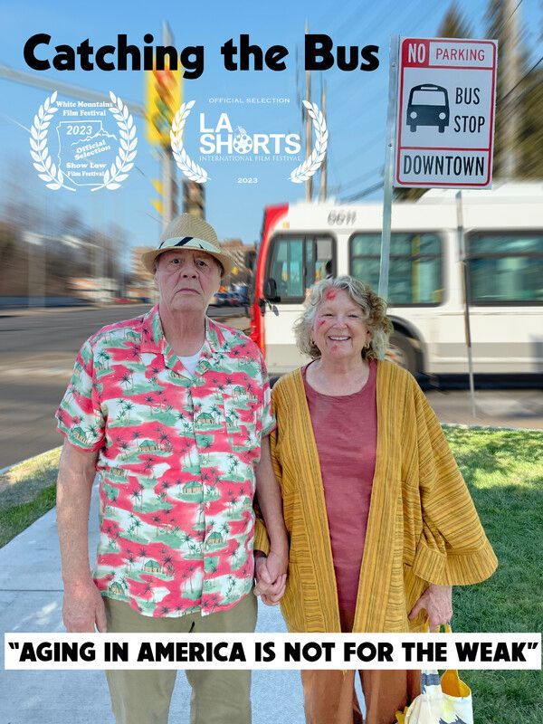 Elderly couple holding hands by a bus stop. The sign says