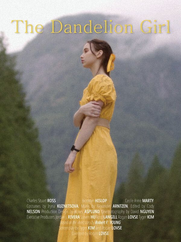 Woman in yellow dress with mountains behind, film poster for