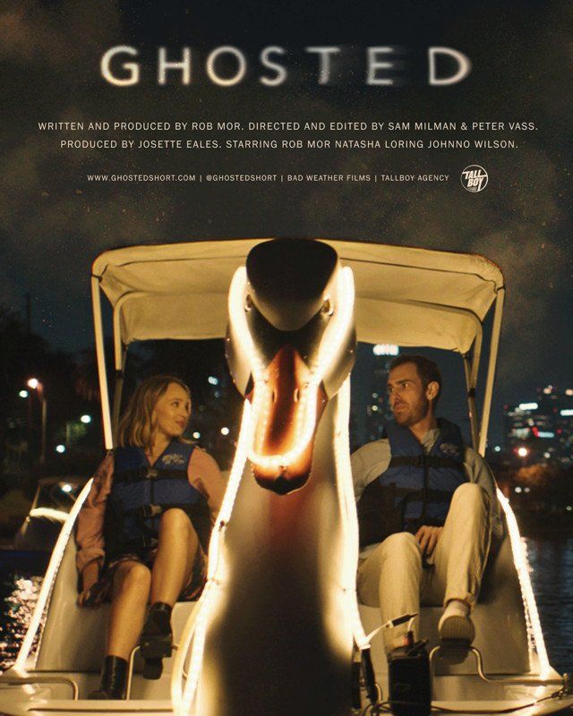 Two people in a swan boat at night. Movie poster for