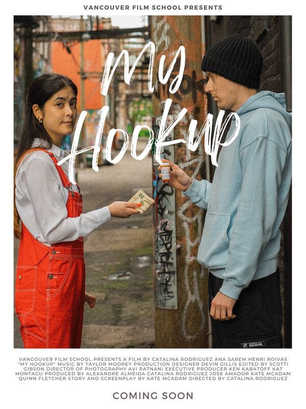 Young woman in red overalls and man with black beanie; exchanging money for medicine in an alley.