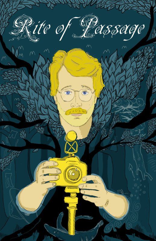 Man with a mustache holding a golden camera against a forest backdrop.