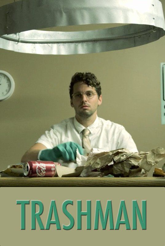A man sorting trash at a desk, wearing gloves and a tie, with a clock on the wall.