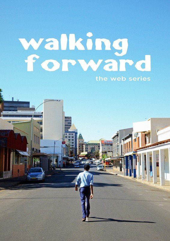 Man walking down a city street with text