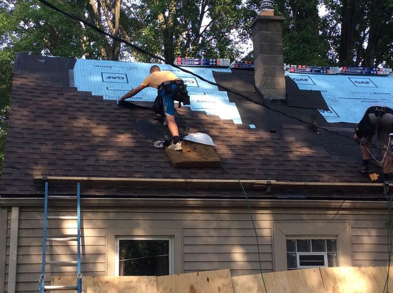 a man on a roof.
