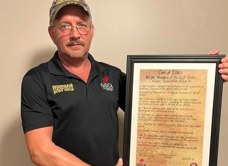 Man Standing With Certificate | Windham Bodyshop