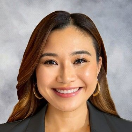 Studio portrait of a woman against a gray background