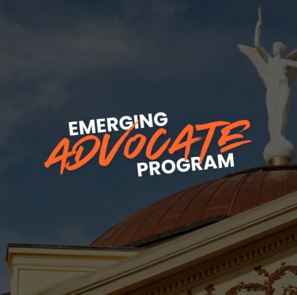 Emerging Advocate Program text over a building dome with a statue against a blue sky