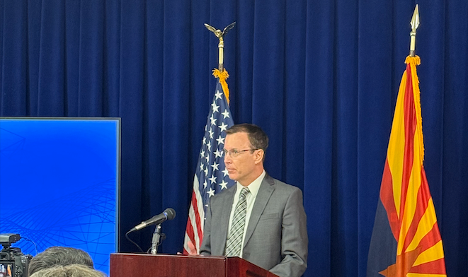 ArMA's 134th President, Dr. Jason Jameson stands in front of the American and Arizona State flags to deliver a speech