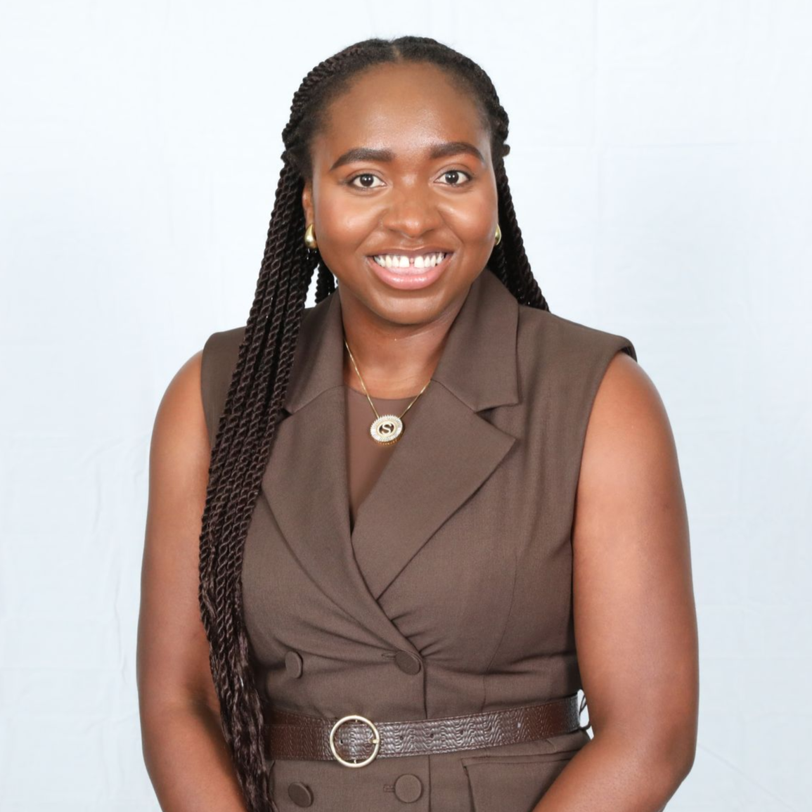 Studio portrait of a woman against a gray background