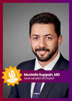 Portrait of Mustafa Suppiah, MD, in a suit with an ALMA member spotlight banner