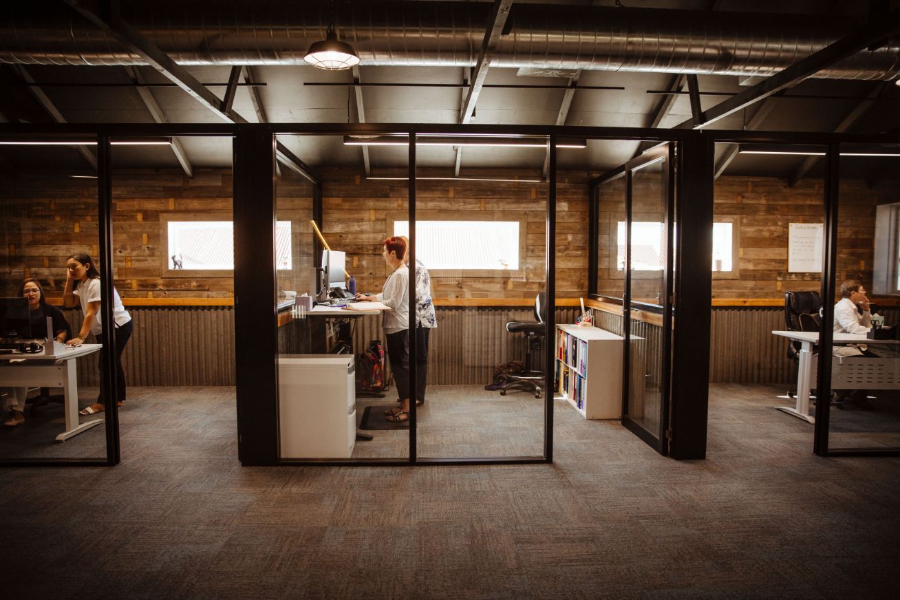 A Group of People Are Sitting at Desks in An Office — Catalyst Accounting & Tax in Killarney, QLD