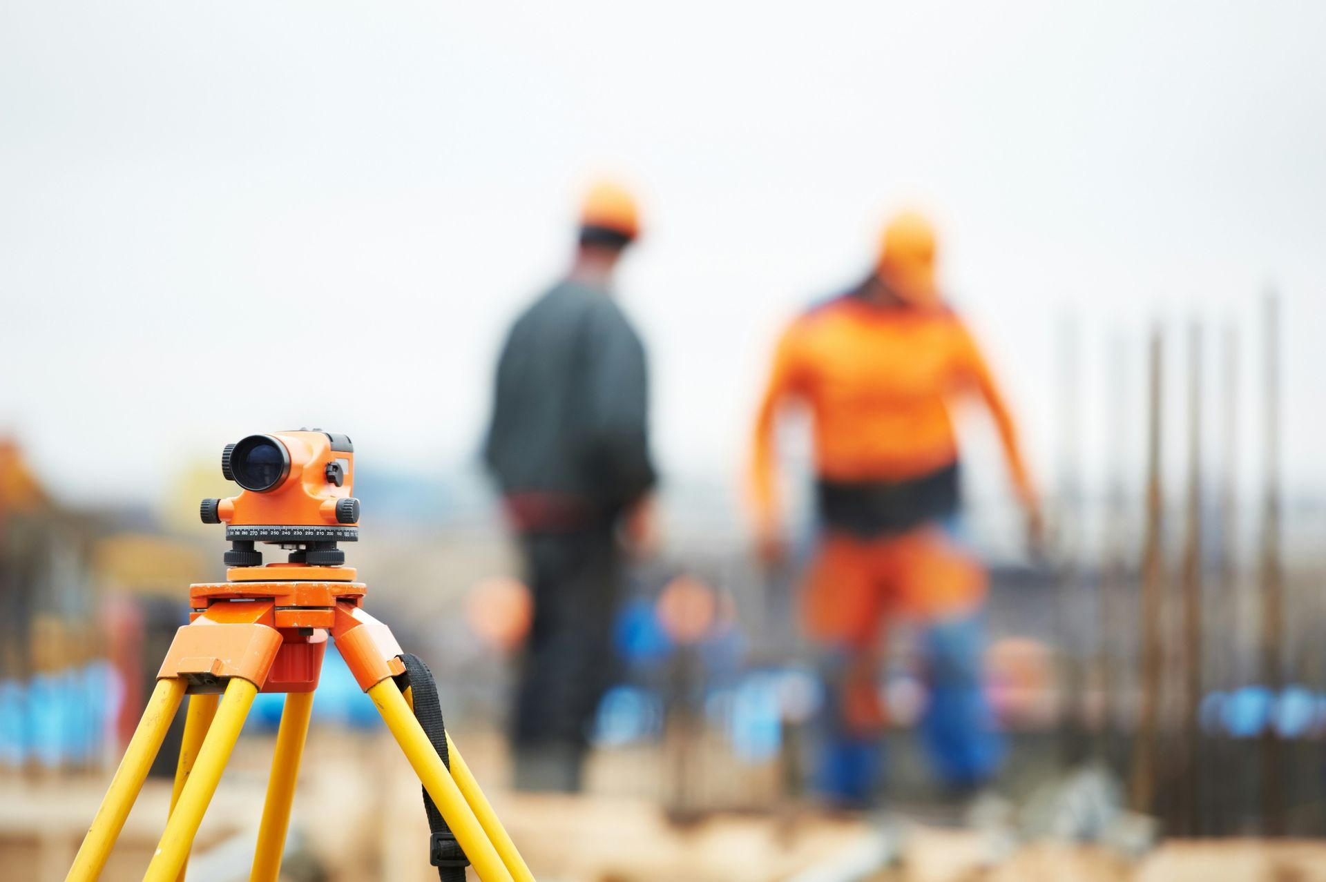 Surveyor recording completed construction works for an as-constructed survey