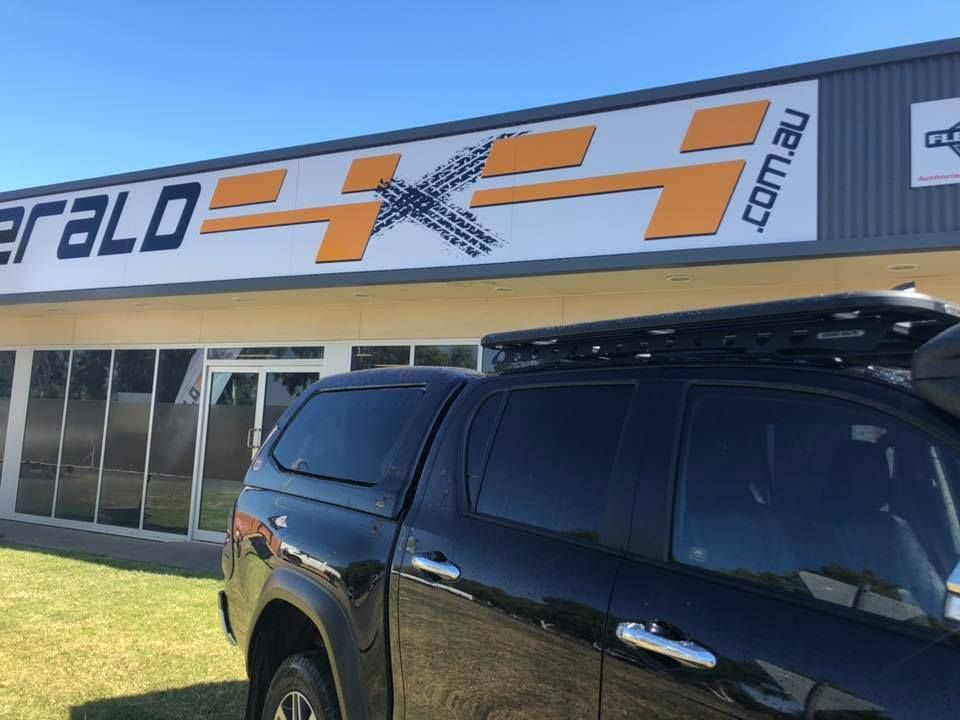 A Black Truck is Parked in Front of a Building That Says Emerald 4x4 — Emerald 4x4 in Emerald, QLD