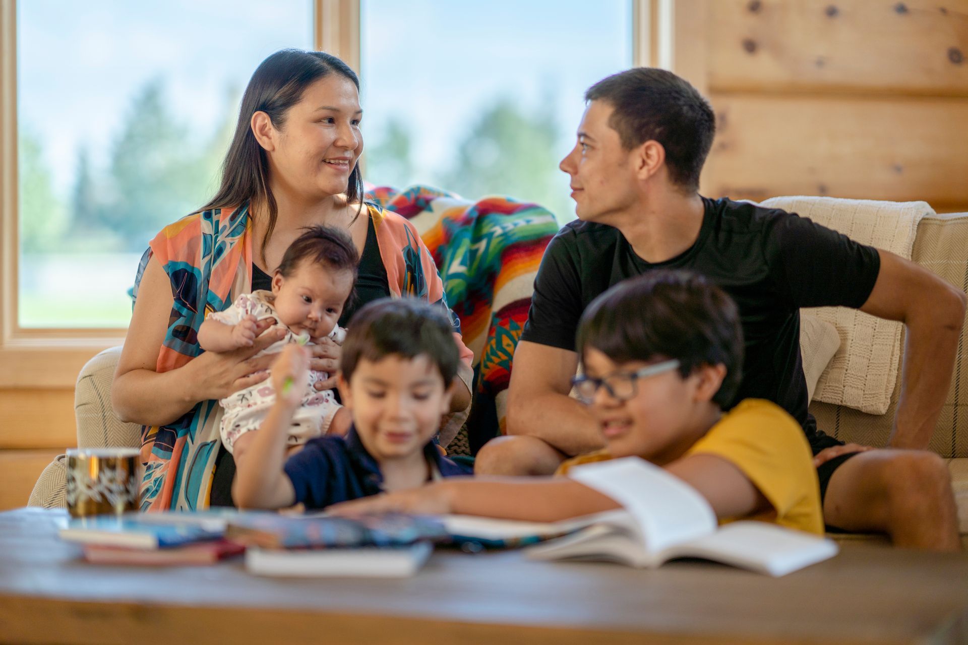 Happy family sitting together reading
