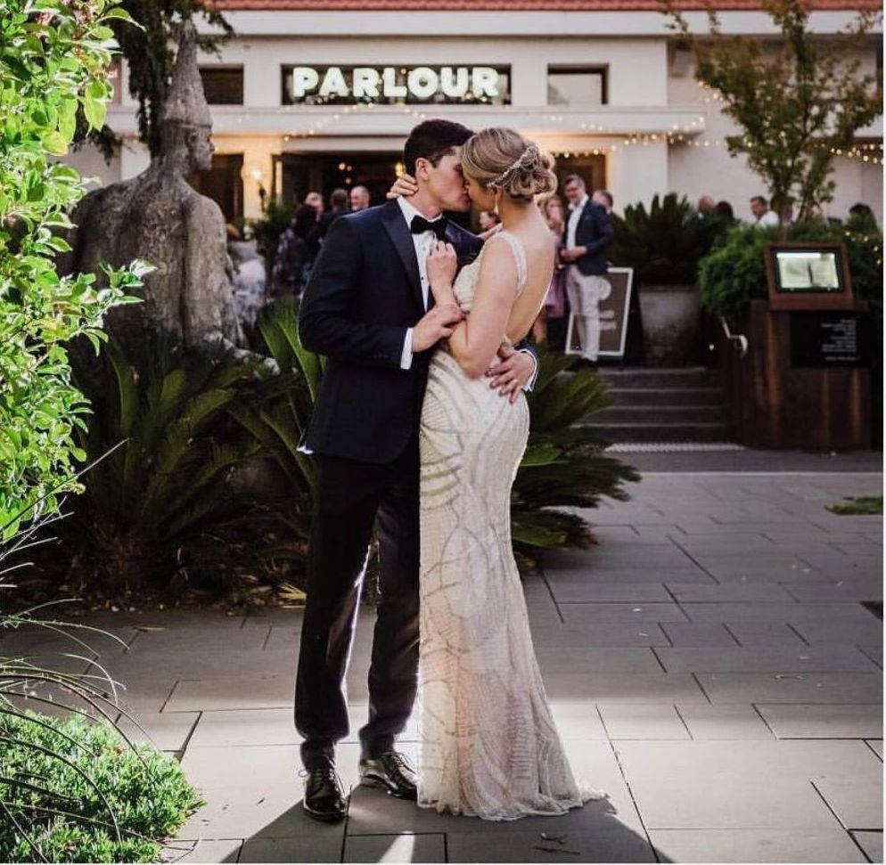 maison-de-challie-bride-white-structured-gown-with-partner-wide-shot