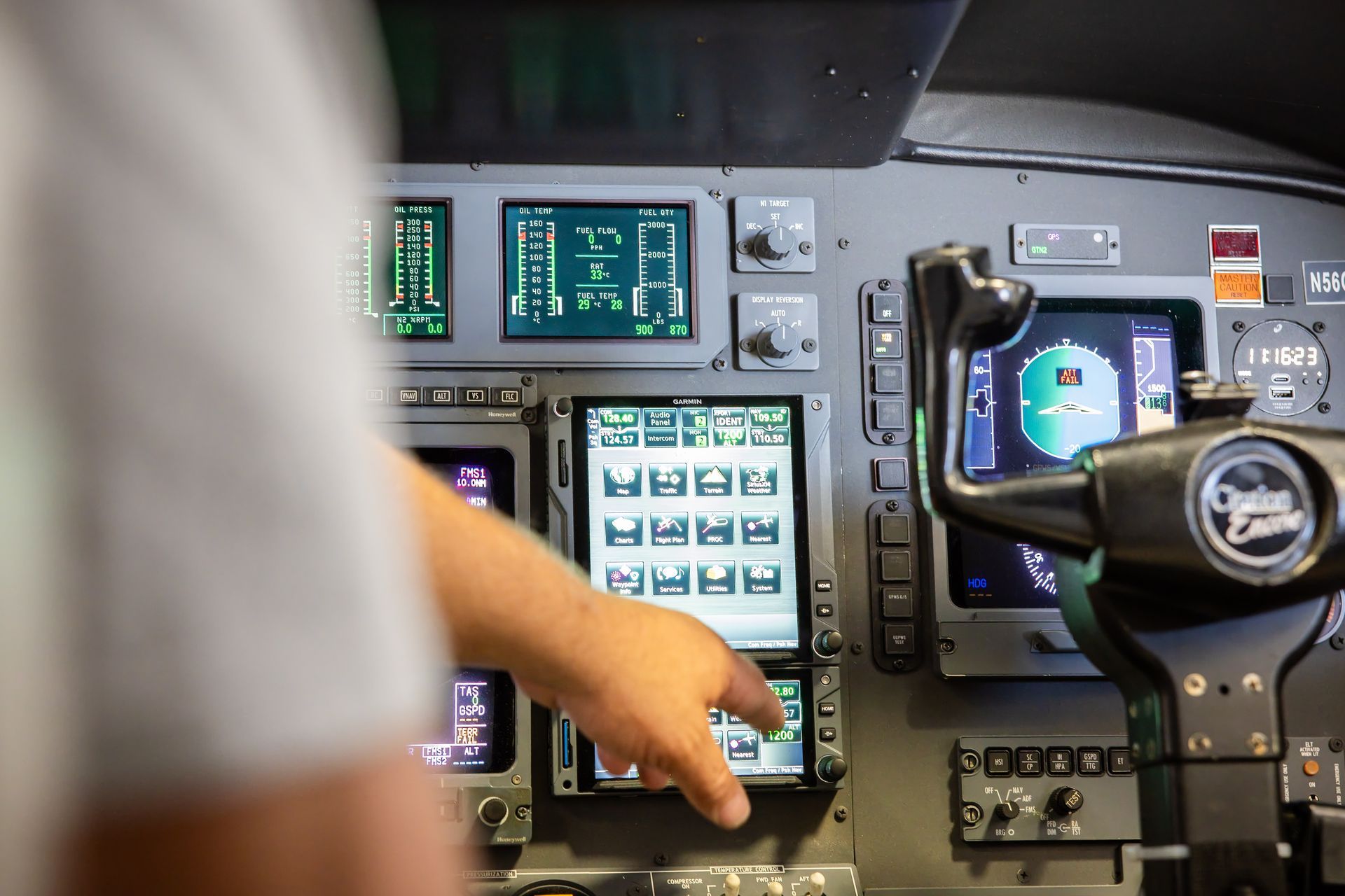 Hands installing avionics wiring