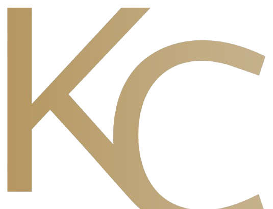 A stylized, tan-colored logo consisting of the letters 