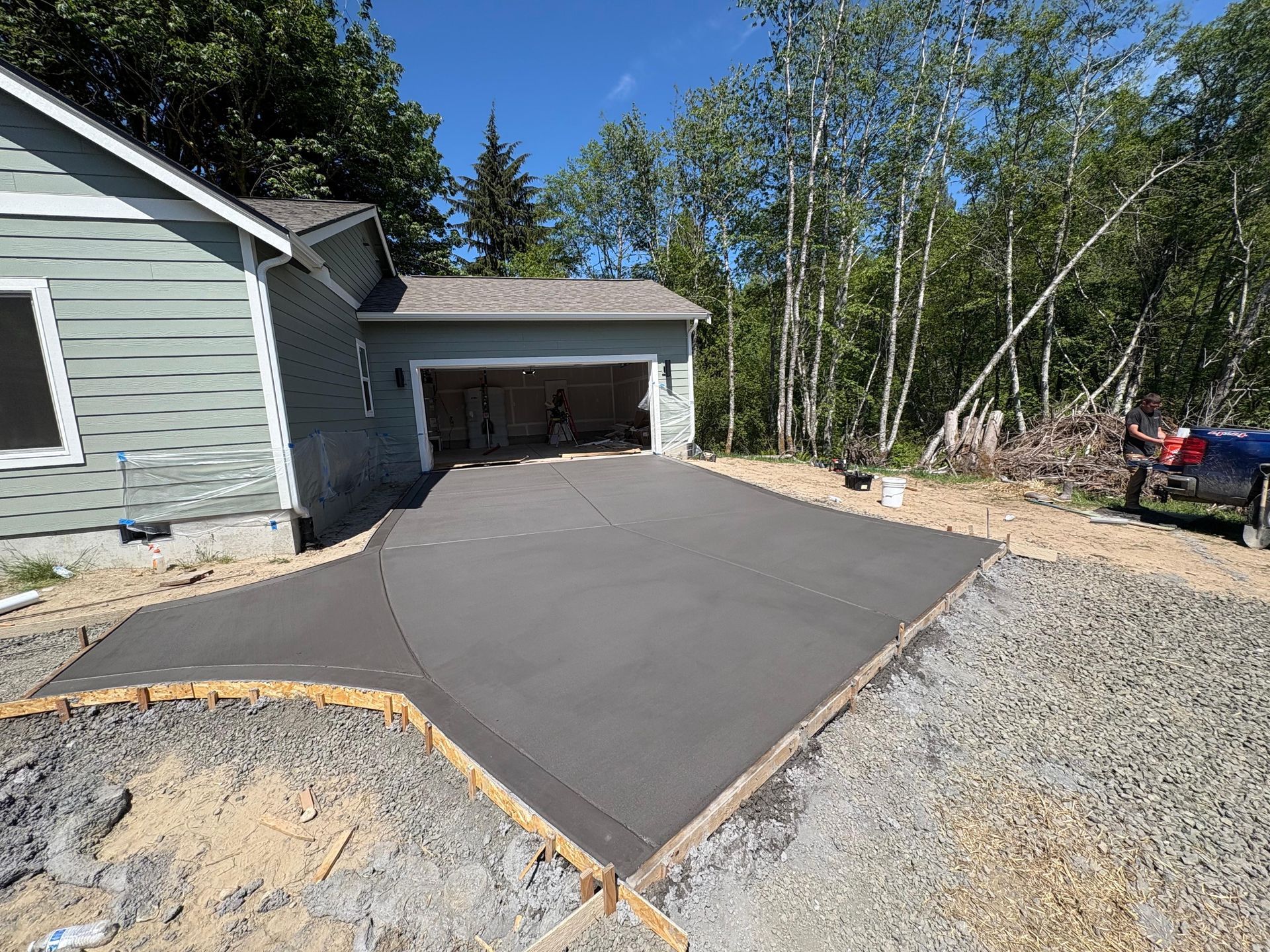 A house with a concrete driveway leading to it
