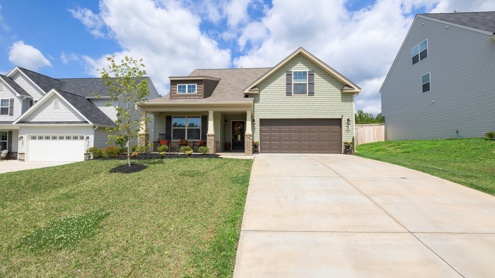 Concrete driveway in front of a modern home in Silverdale WA showing smooth finish and spacious double-car design.