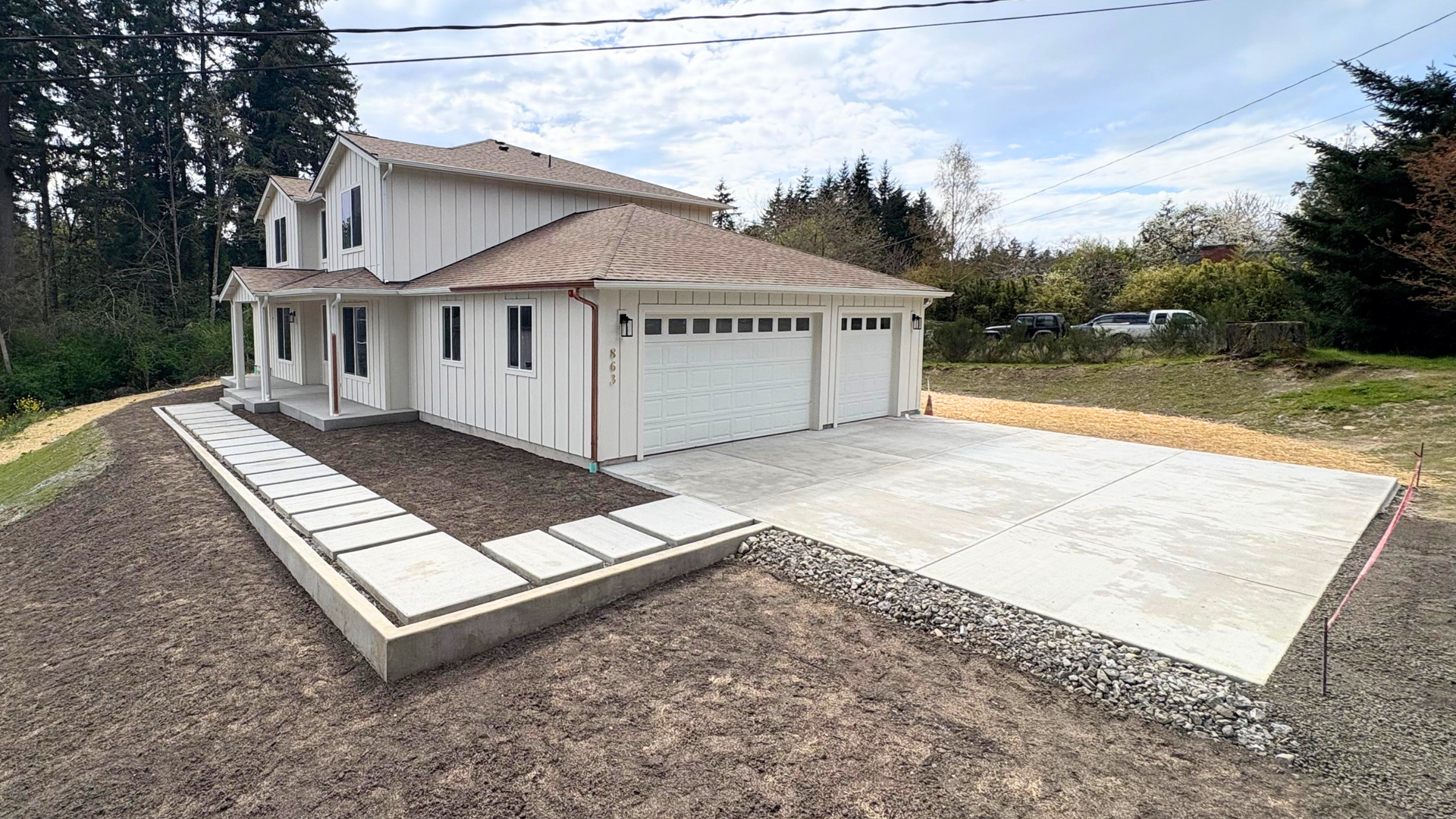New residential concrete driveway at a Silverdale WA home subject to Kitsap County permit rules