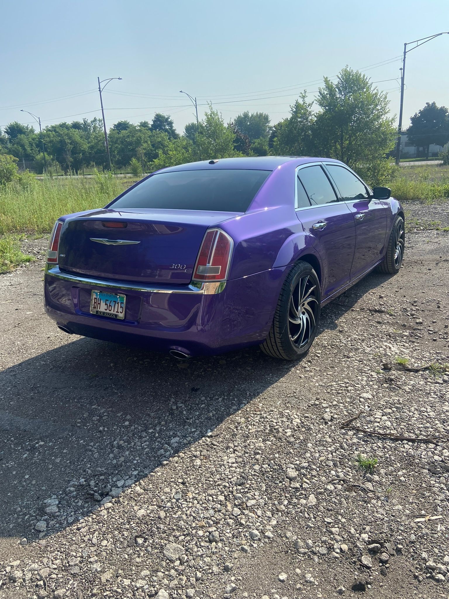 A Purple Car Is Parked on A Gravel Road — Chicago, IL — Ecuamex Autobody Inc.