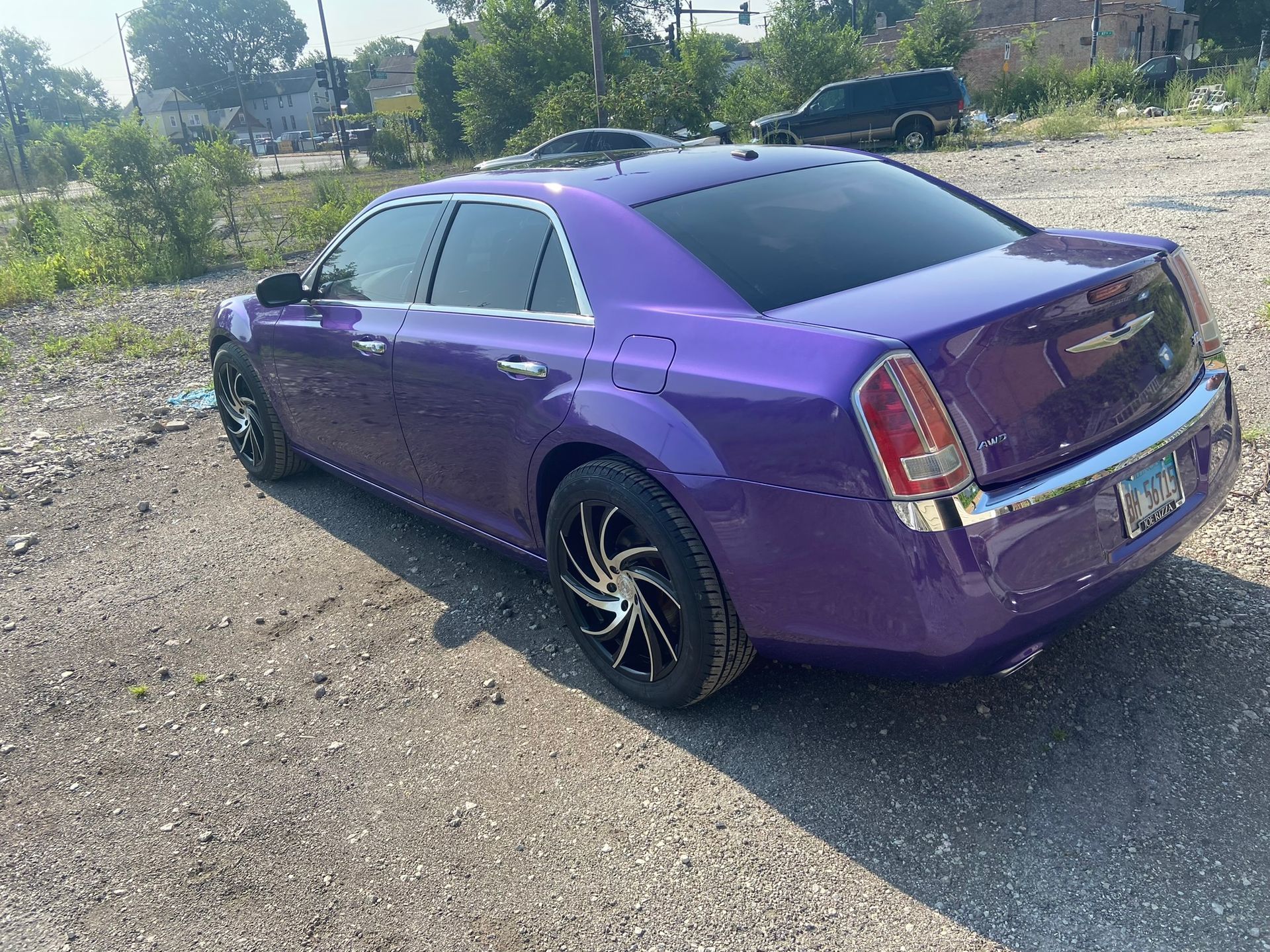A Purple Car Is Parked in A Gravel Lot — Chicago, IL — Ecuamex Autobody Inc.