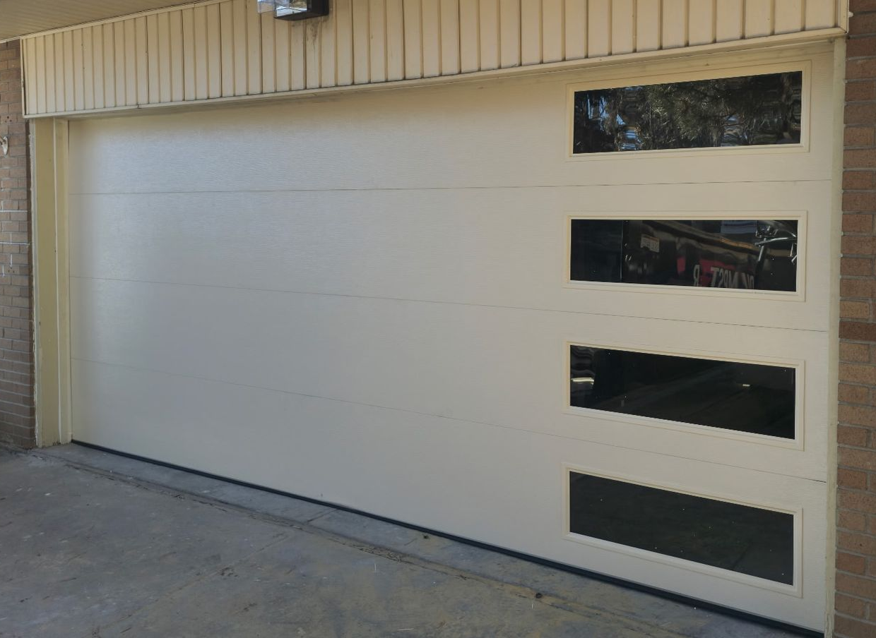 Custom glass garage door installation in Aurora CO