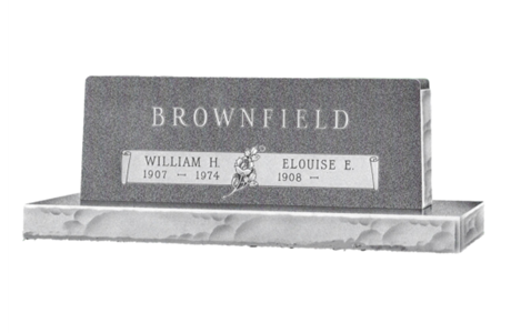 A black and white photo of a gravestone for brownfield