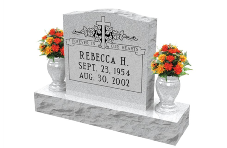 A gravestone for rebecca h. with two vases of flowers