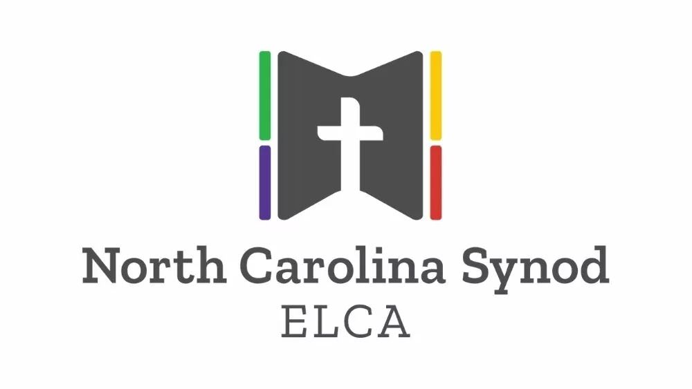 Logo of North Carolina Synod, ELCA: gray book with white cross, green, purple, yellow, and red accents.