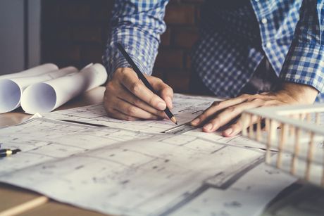 concept architects engineer holding pen pointing