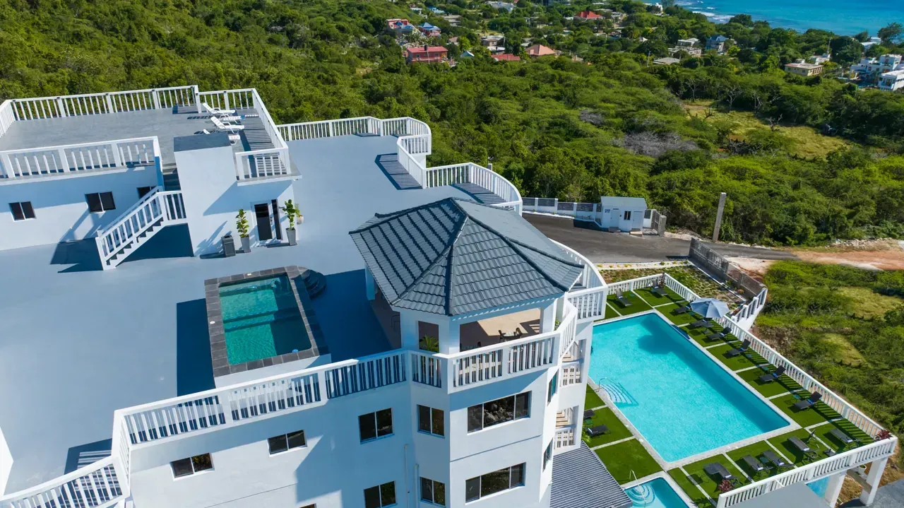 Majestic Heights and its pools above Billy’s Bay