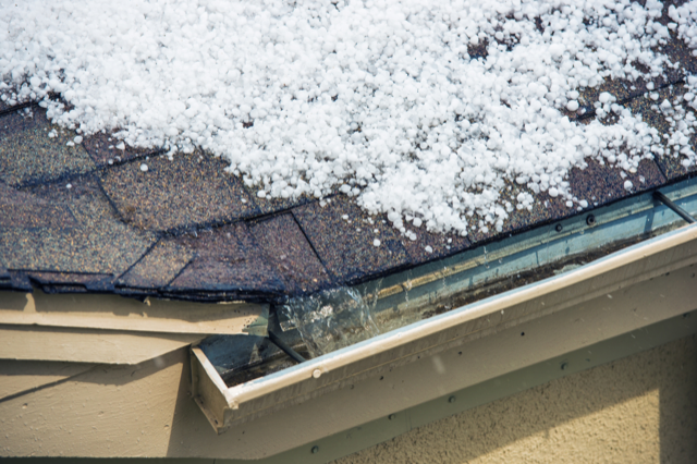 a gutter full of water and ice