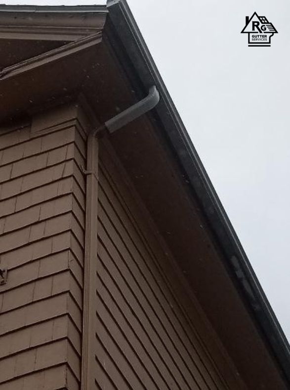 A house with a gutter on the side of it