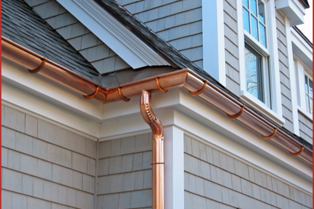 a house with copper gutters all around the roof