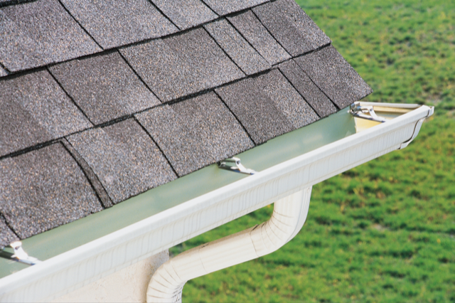 new white gutters on a houses roof