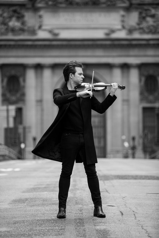Gregory Harrington performing on violin in a publicity photo, international
violinist and recording artist