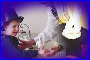 Child in a purple hat smiles while receiving a hand massage from a person in a white coat.