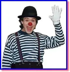Clown in black hat and striped shirt, smiling and waving with a raised white-gloved hand.