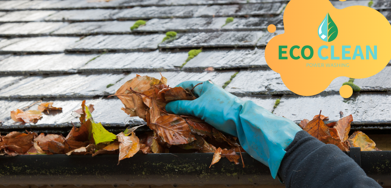 gutter cleaning service central pa A person wearing rubber gloves is cleaning a gutter with leaves.