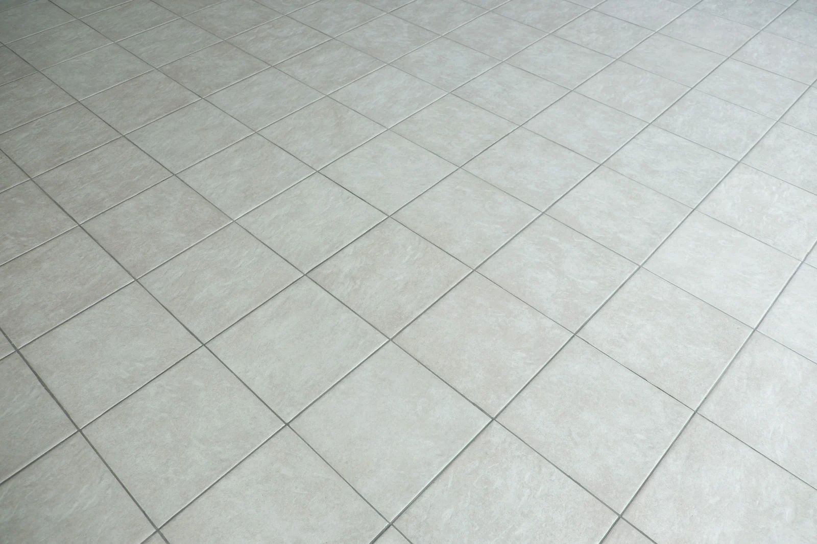 Light gray tiled floor with a diamond pattern