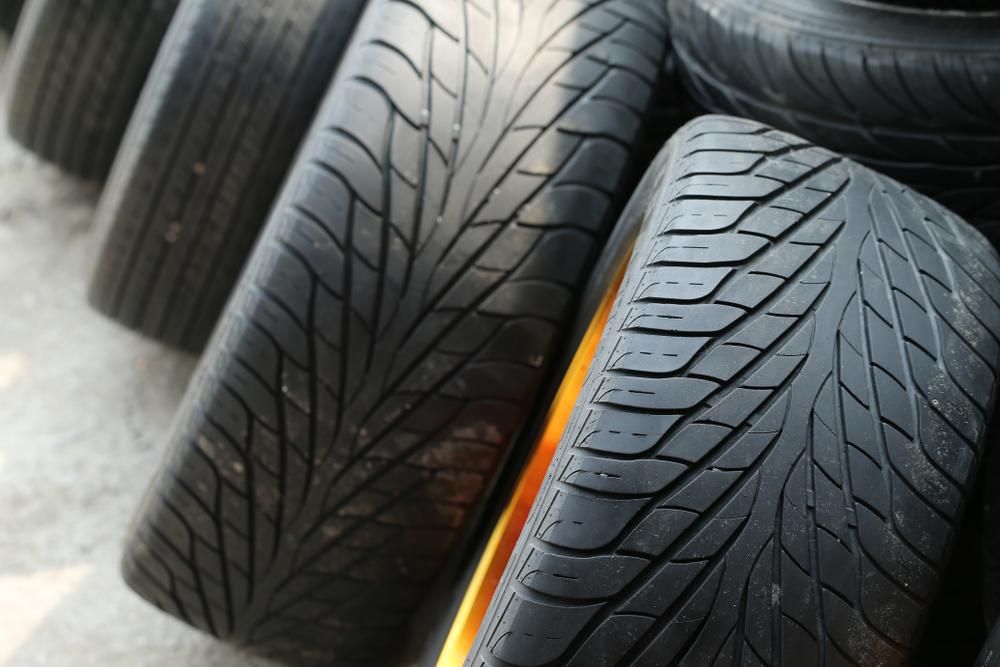 A Bunch of Tires Are Stacked on Top of Each Other — Petersen's Second Hand & New Tyres in Currajong, QLD