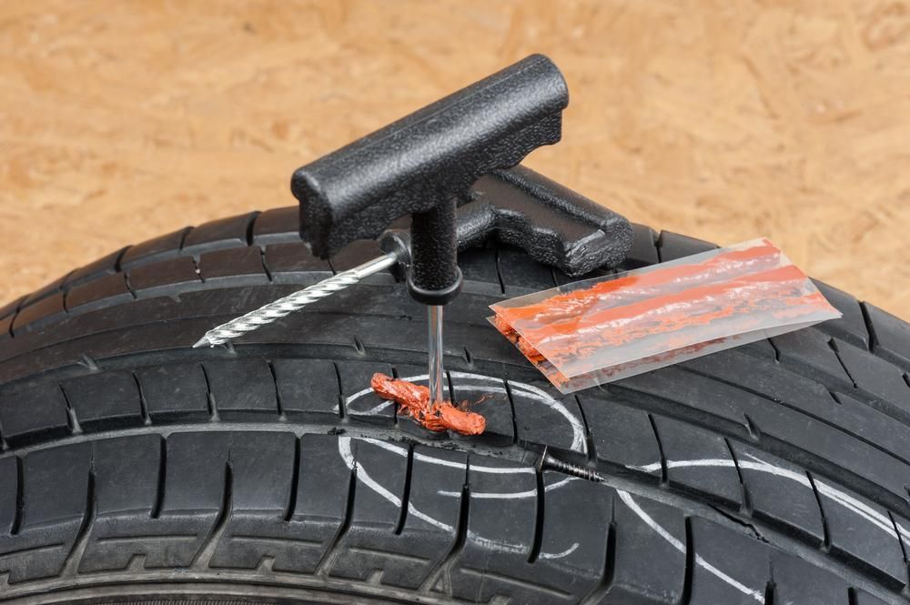 A Close up Of a Tire with A Screw in It — Petersen's Second Hand & New Tyres in Currajong, QLD