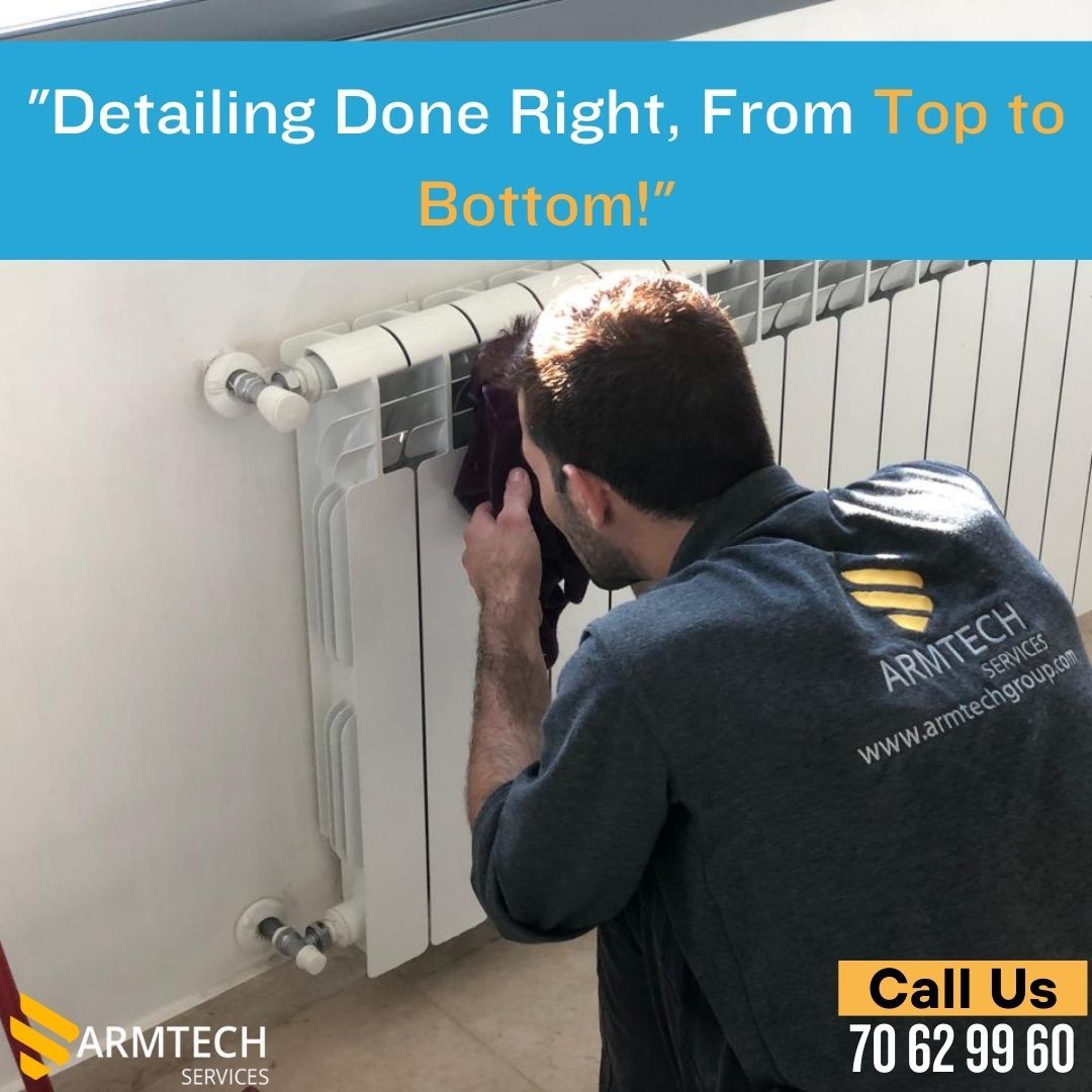 A man cleaning a radiator with the words 