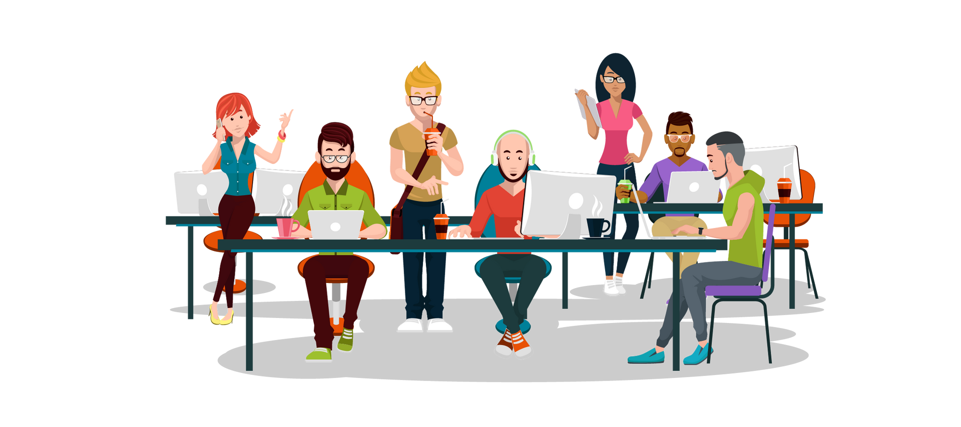 A group of people are sitting at tables with laptops.
