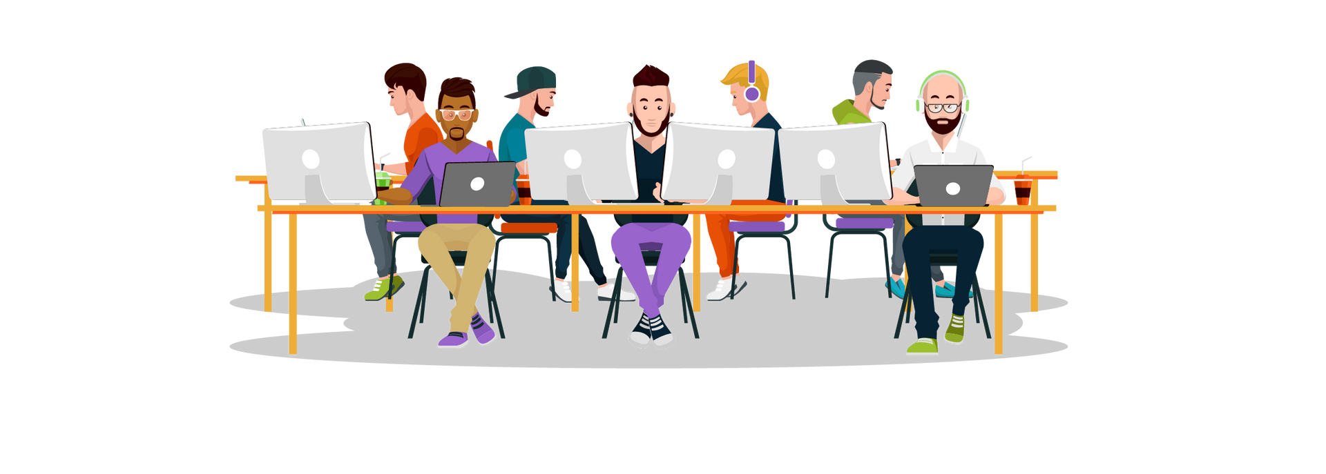 A group of people are sitting at a table with laptops.