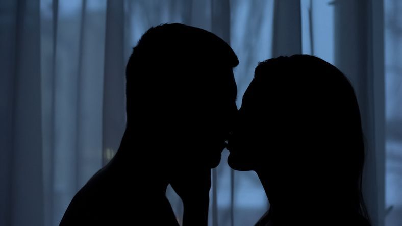 Couple kissing in the Dark | adult friend finder